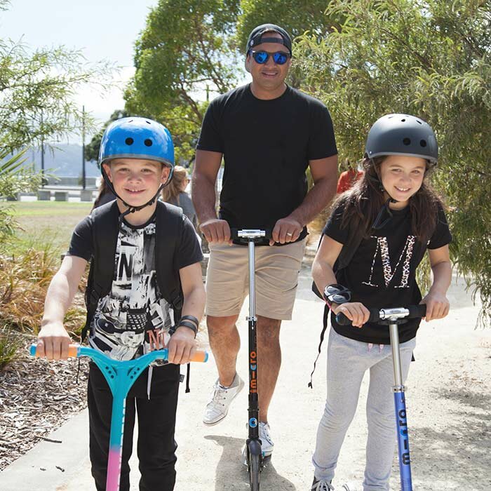 dad-and-kids-on-micro-scooters